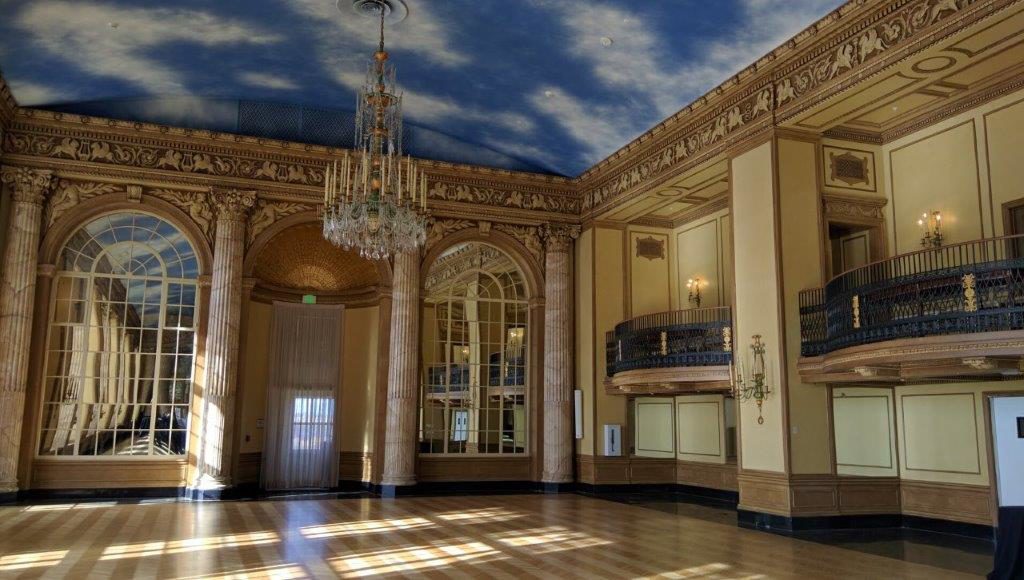   A blue sky mural crowns the Grand Ballroom 